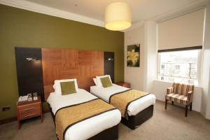 橡果国际酒店客房内的一张或多张床位