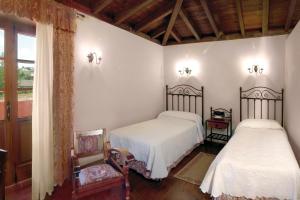 萨尔瓦多卡萨乡村酒店客房内的一张或多张床位