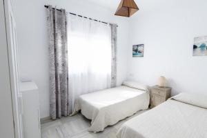 Apartamento Pasaje Del Mar客房内的一张或多张床位