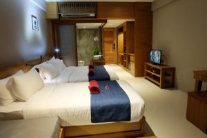 Koh Ma Beach Resort - SHA Extra Plus客房内的一张或多张床位