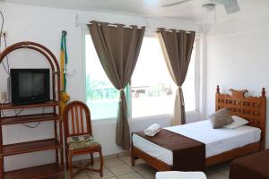 Hotel Arrecife Chachalacas客房内的一张或多张床位