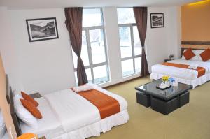 金马仑高原双星酒店 客房内的一张或多张床位