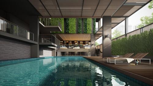 曼谷快乐3号酒店的建筑物中游泳池的形象
