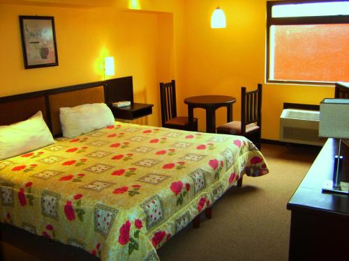 勒噶尔酒店客房内的一张或多张床位