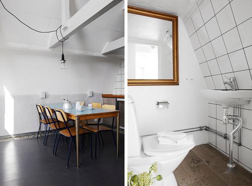 HavdhemGotland Magazin1 Guesthouse的一间带桌子的浴室和一间带水槽的浴室
