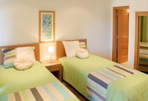 圣安东尼奥别墅高尔夫Spa美景度假村客房内的一张或多张床位