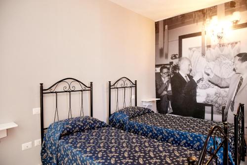 Hotel Ospite Inatteso客房内的一张或多张床位
