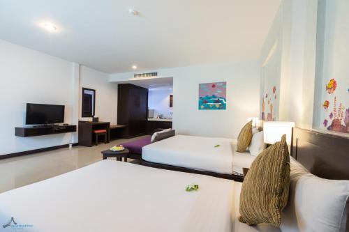 Krabi Aquamarine Resort - SHA Plus客房内的一张或多张床位