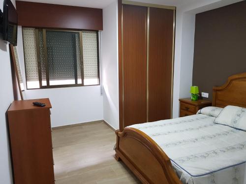 Apartamento Bueu Familiar客房内的一张或多张床位