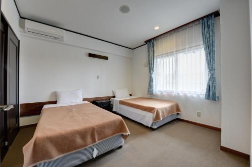 莫里马尔海滩度假公寓客房内的一张或多张床位
