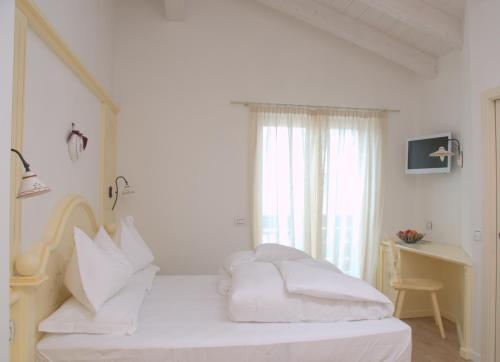 瑞莱斯费奥迪博斯科酒店客房内的一张或多张床位