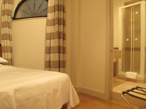 圣奇阿拉酒店客房内的一张或多张床位