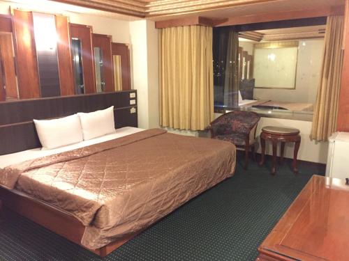 巴中圣淘沙旅馆客房内的一张或多张床位