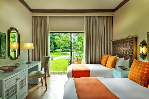 Avani Victoria Falls Resort客房内的一张或多张床位