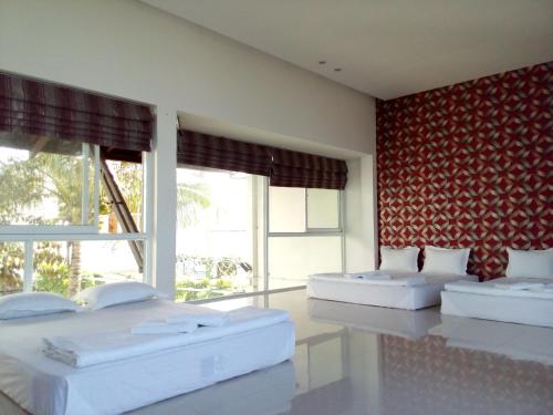 湄公河酒店及餐厅客房内的一张或多张床位