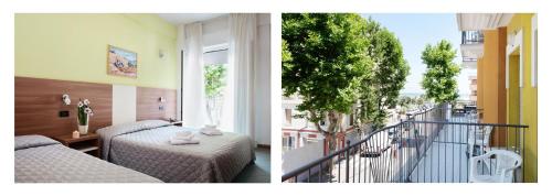 里米尼圣皮埃尔酒店的酒店客房设有两张床和一个阳台。