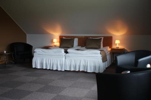 斯科姆玛斯加登霍格博酒店客房内的一张或多张床位