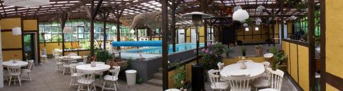 Vindeby达宁胡斯旅馆的一间带游泳池和桌椅的餐厅