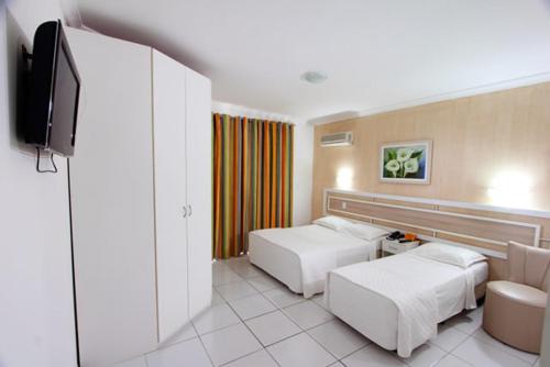 Hotel Adriattico客房内的一张或多张床位