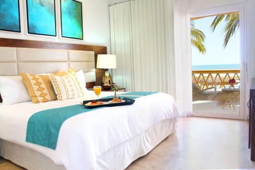 Las Villas Hotel & Golf By Estrella del Mar客房内的一张或多张床位