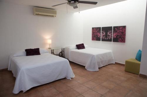 Cozy house downtown Cancun客房内的一张或多张床位