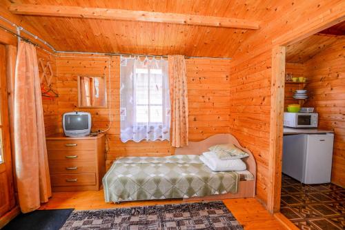 祖古提斯家园山林小屋客房内的一张或多张床位