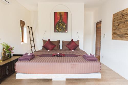 热带季节度假别墅客房内的一张或多张床位