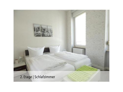 Ferienwohnung Trier Stadtmitte/Fußgängerzone客房内的一张或多张床位