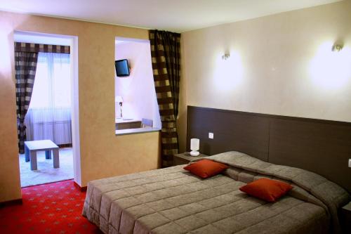 乐科迈司酒店客房内的一张或多张床位