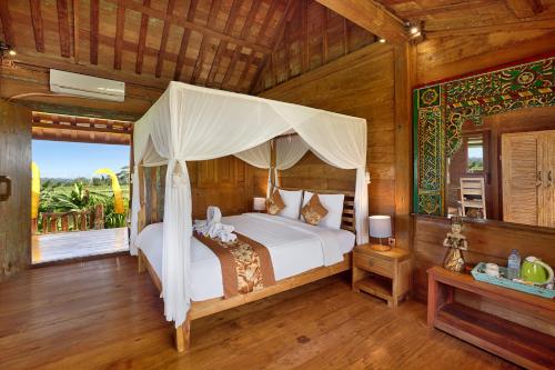 巴厘岛狄阿莫酒店客房内的一张或多张床位