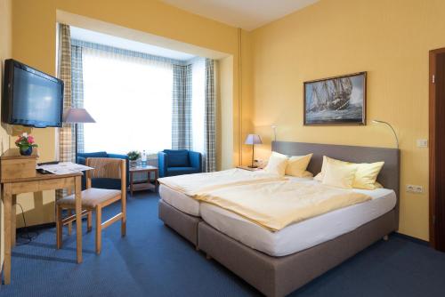 阿特兰提卡伽尼酒店客房内的一张或多张床位
