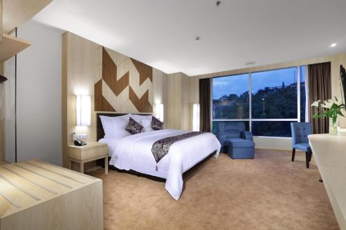 ASTON Batam Hotel & Residence客房内的一张或多张床位
