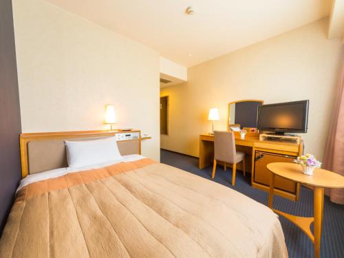 新阪急高知皇冠饭店 客房内的一张或多张床位