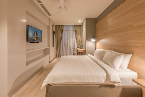 金厚德服务式公寓酒店客房内的一张或多张床位