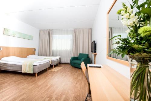 GreenStar Hotel Joensuu客房内的一张或多张床位
