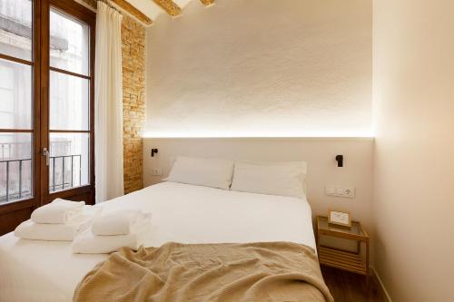 Decô Apartments Barcelona-Born Apt.客房内的一张或多张床位