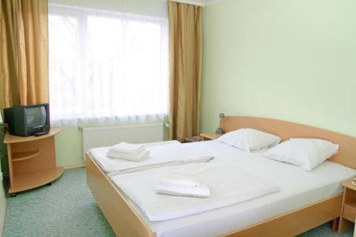 可卡瓦公园酒店客房内的一张或多张床位