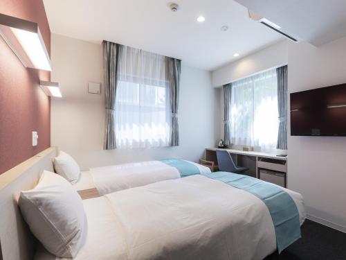 博多新干线口永安国际大酒店客房内的一张或多张床位