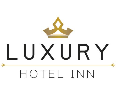 拉佩尼塔德加尔特姆巴Luxury Hotel Inn的黑色豪华酒店标志与皇冠