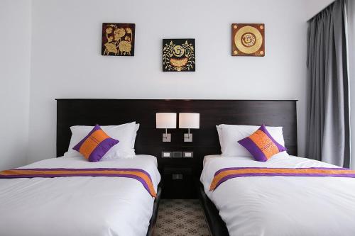 萨库斯迈尔度假酒店客房内的一张或多张床位