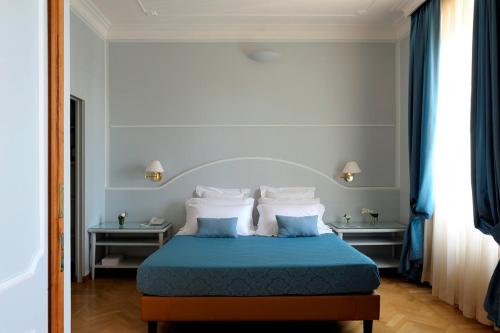 德亚套房罗马酒店客房内的一张或多张床位