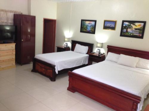 Hotel MundialCity客房内的一张或多张床位