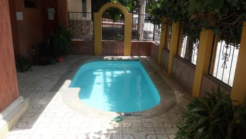 Apartamento Perla del Caribe内部或周边的泳池