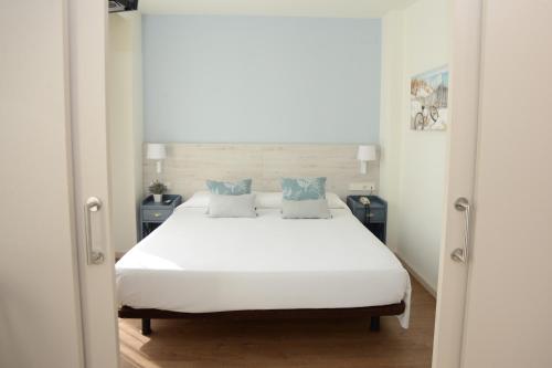 Hotel L'Escala Centre客房内的一张或多张床位