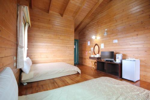 清境小太阳景观木屋 客房内的一张或多张床位