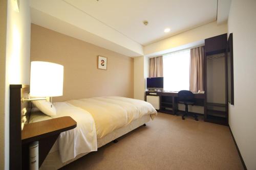 广岛和平公园酒店客房内的一张或多张床位