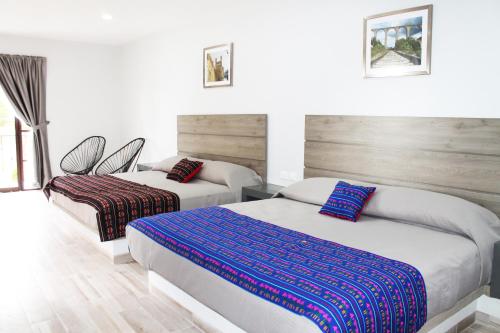 Quinta Huizache客房内的一张或多张床位