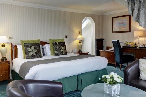 贝斯特韦斯特皇家酒店客房内的一张或多张床位