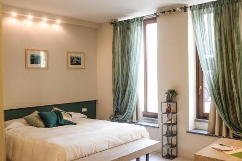 斯帕齐奥[比安科]酒店客房内的一张或多张床位
