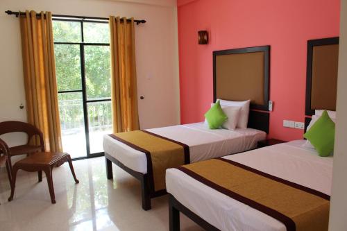 Organic Garden Resort Sigiriya客房内的一张或多张床位